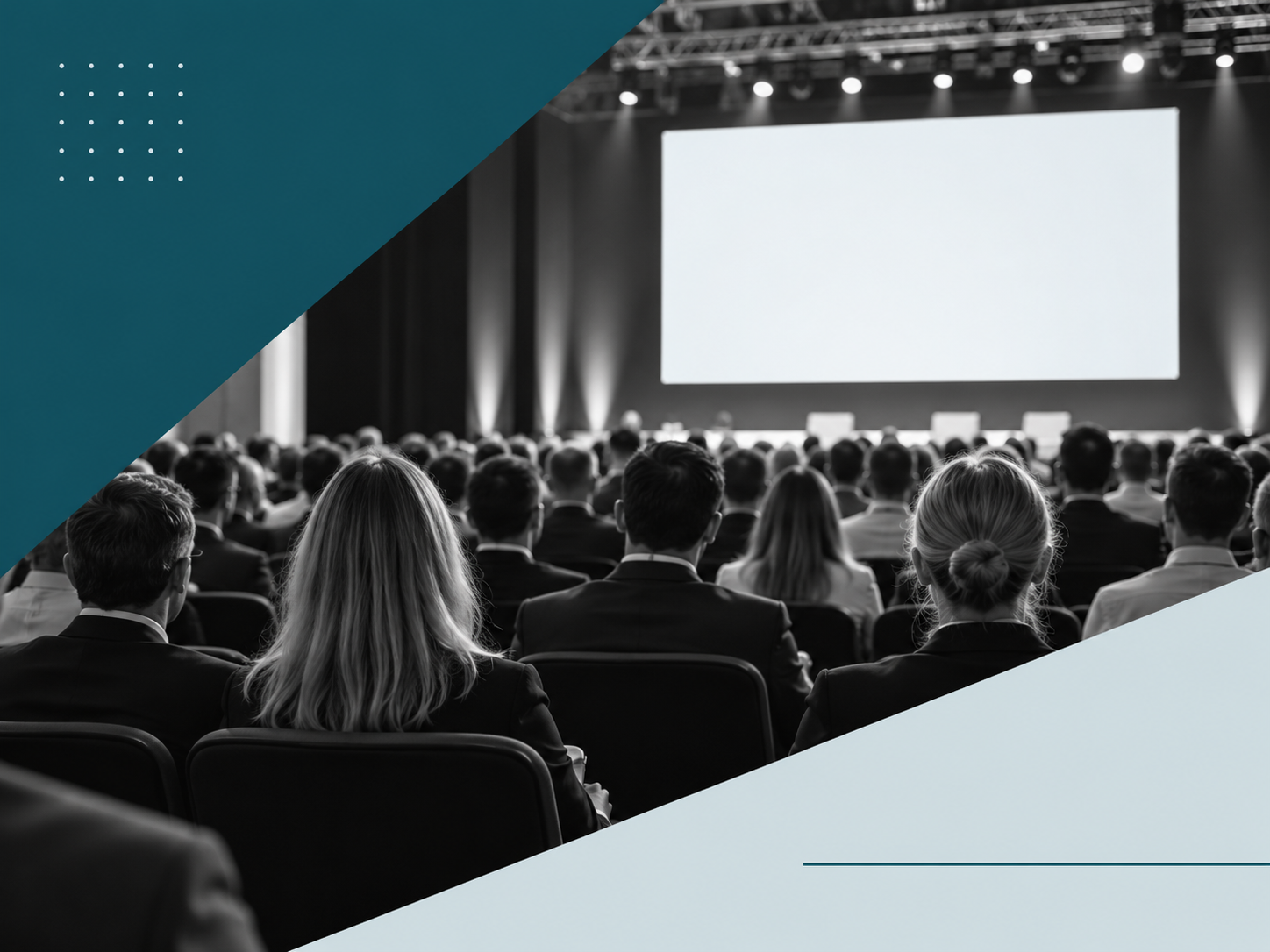 Audience seated in a conference hall facing a stage and large presentation screen.